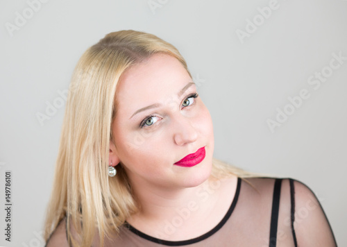 portrait of attractive blonde woman in evening dress