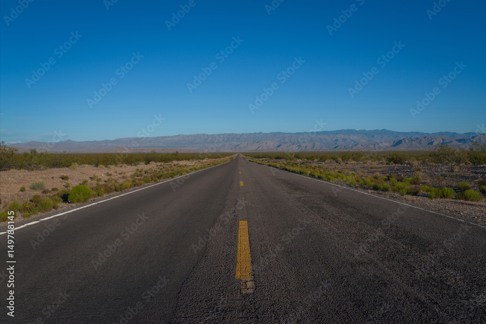 Long straightaway on a highway in the desert 