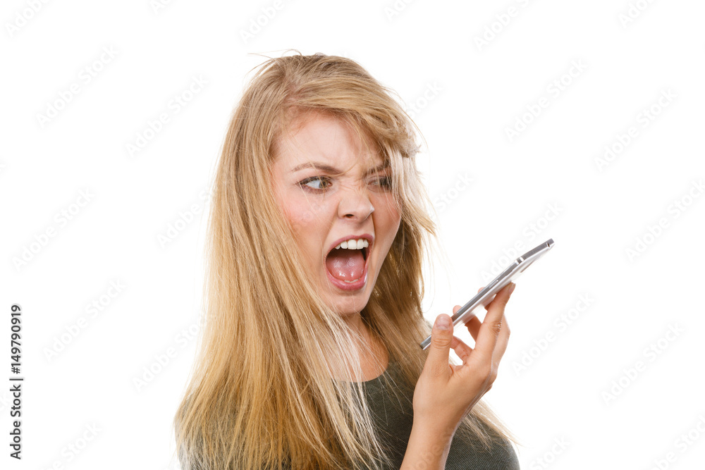 Angry young woman talking on phone Angry young woman talking on phone