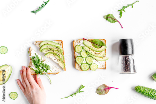 fitness breskfast with homemade sandwiches white table background top view photo