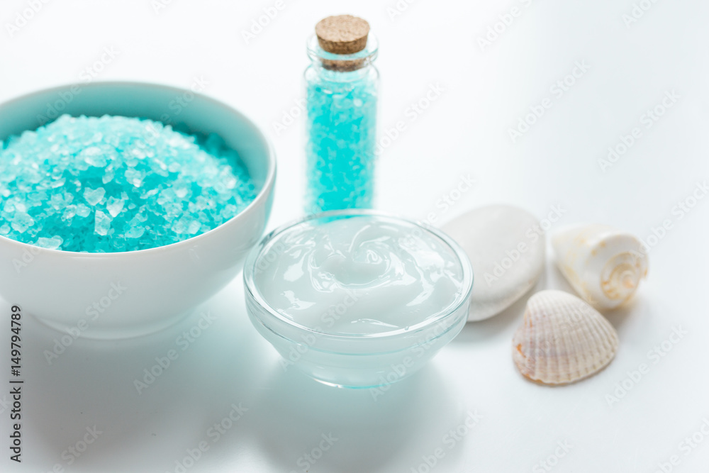 blue sea salt and body cream on white desk background blue sea salt and body cream on white desk background