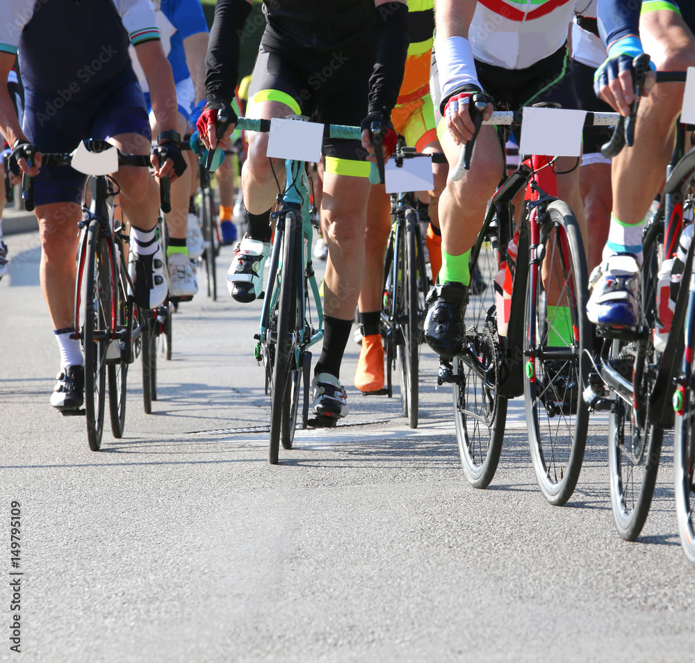 Fototapeta premium Fast cyclists during the race on city roads
