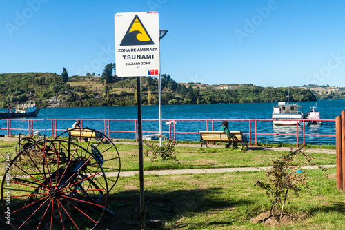 CASTRO, CHILE - MARCH 22, 2015: Tsunami hazard warning sign in Castro, Chiloe island, Chile