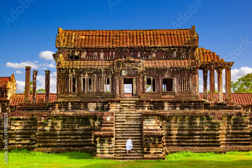 Wallpaper Mural Angkor Wat. Buddhist monk dressed in white arriving at North Thousand God Library. Siem Reap, Cambodia Torontodigital.ca