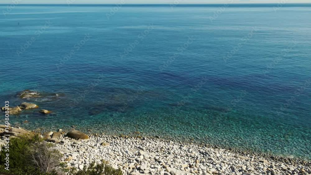 A beautiful transparent paradisiac sea and white stones on the shore in Elba island in Italy, 4K A beautiful transparent paradisiac sea and white stones on the shore in Elba island in Italy, 4K