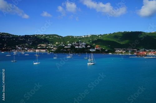 View of Long Bay, St. Thomas island, US Virgin Islands from water with multiple yachts and boats on the foreground © notsunami