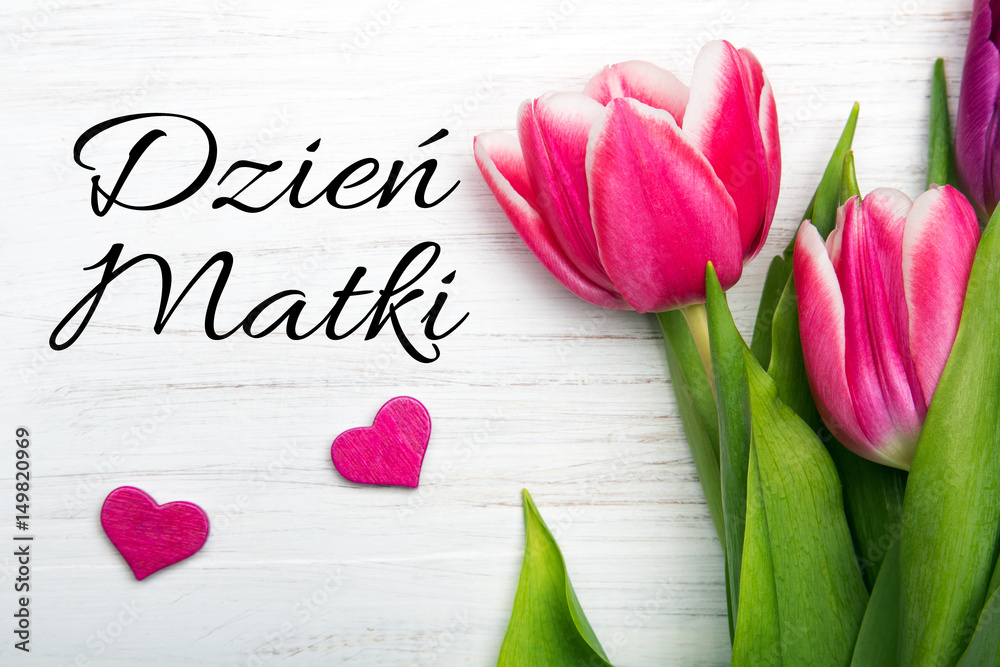Mother's day card with Polish words: Dzien Matki - Mother's Day. Pink tulip on white wooden background. - obrazy, fototapety, plakaty 