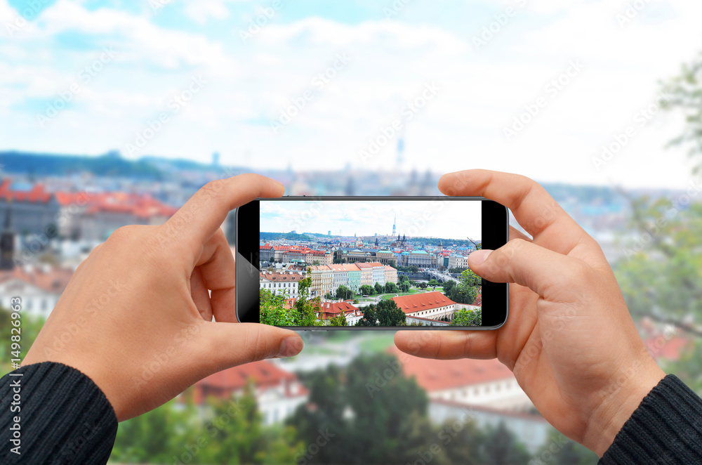 Man taking photo with smartphone of city skyline Man taking photo with smartphone of city skyline