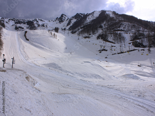 Snowy empty mountain ski gentle slope. Rosa Khutor, Sochi, Russia.