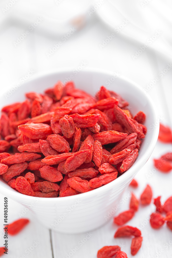 Goji berries in bowl on white background Goji berries in bowl on white background