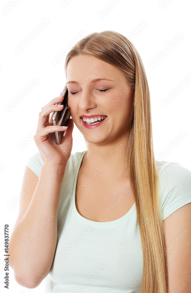 Attractive young woman making a phone call. Attractive young woman making a phone call.