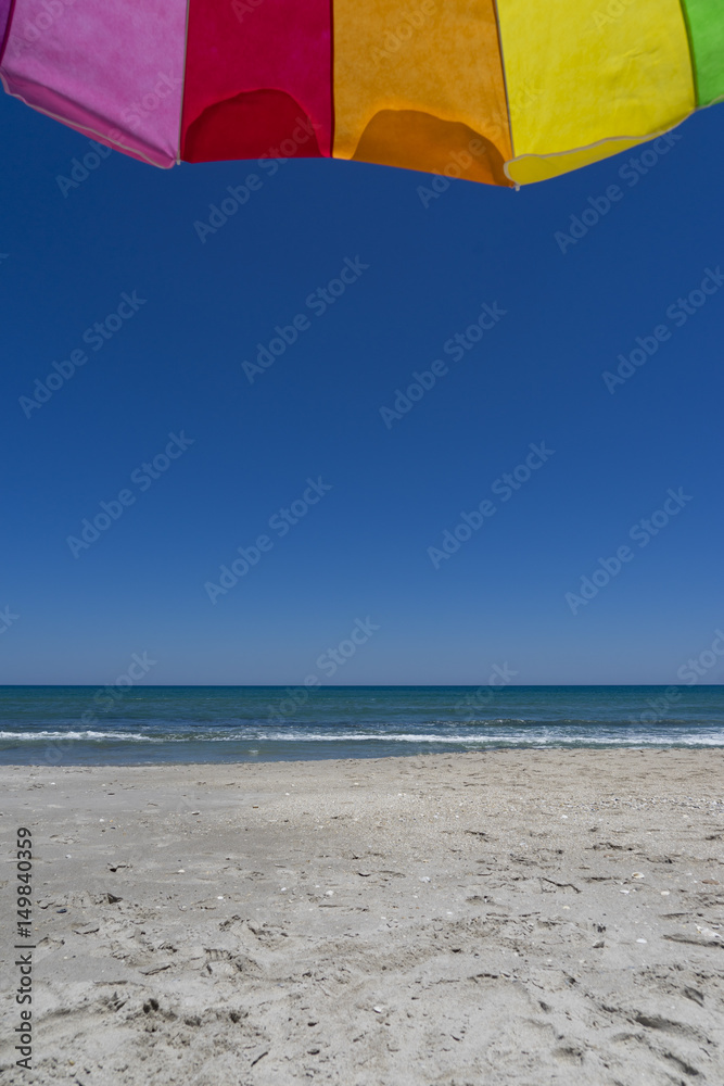 Under an Umbrella at the Beach