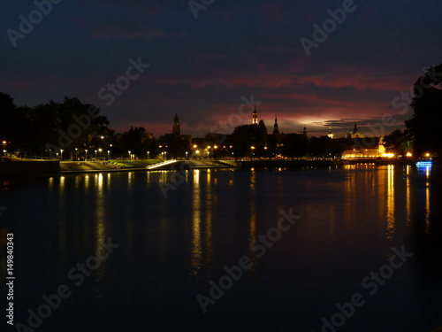 Beautiful and colorful sunset over Wroclaw. Reflection in the Odra River.
