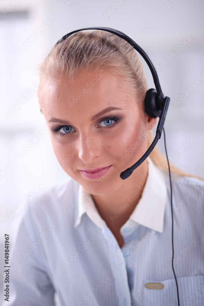 Close-up portrait of a customer service agent sitting at office Close-up portrait of a customer service agent sitting at office