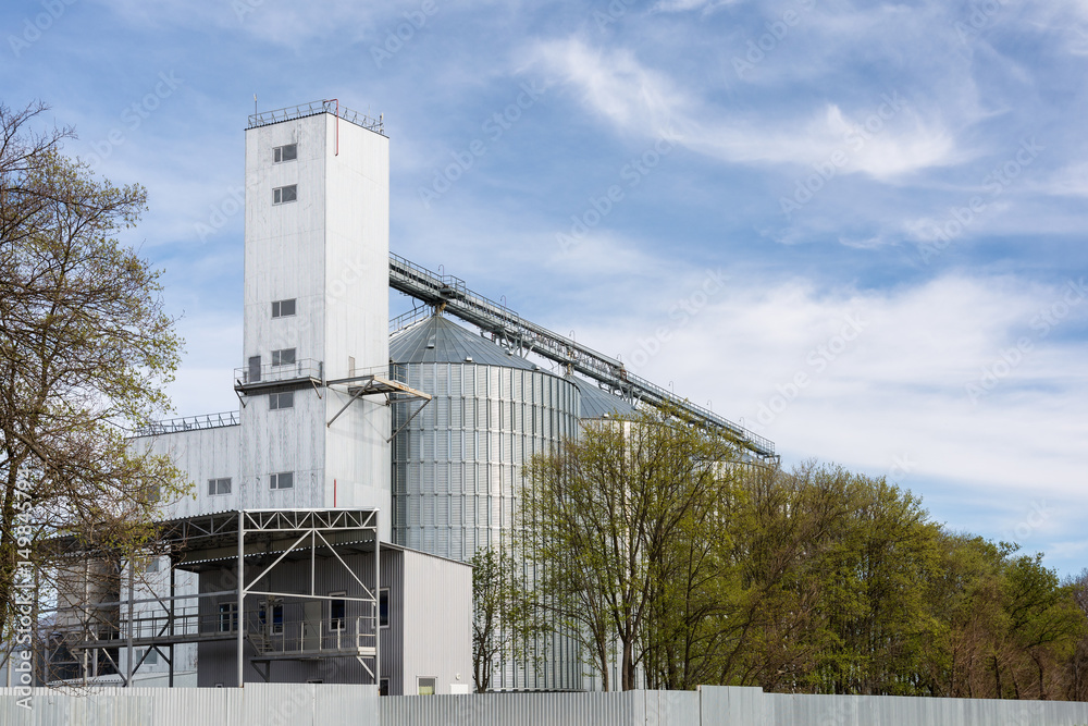 Grain elevator in agricultural zone. Granary with mechanical equipment for receiving, cleaning, drying, grain shipment. Grain elevator in agricultural zone. Granary with mechanical equipment for receiving, cleaning, drying, grain shipment.