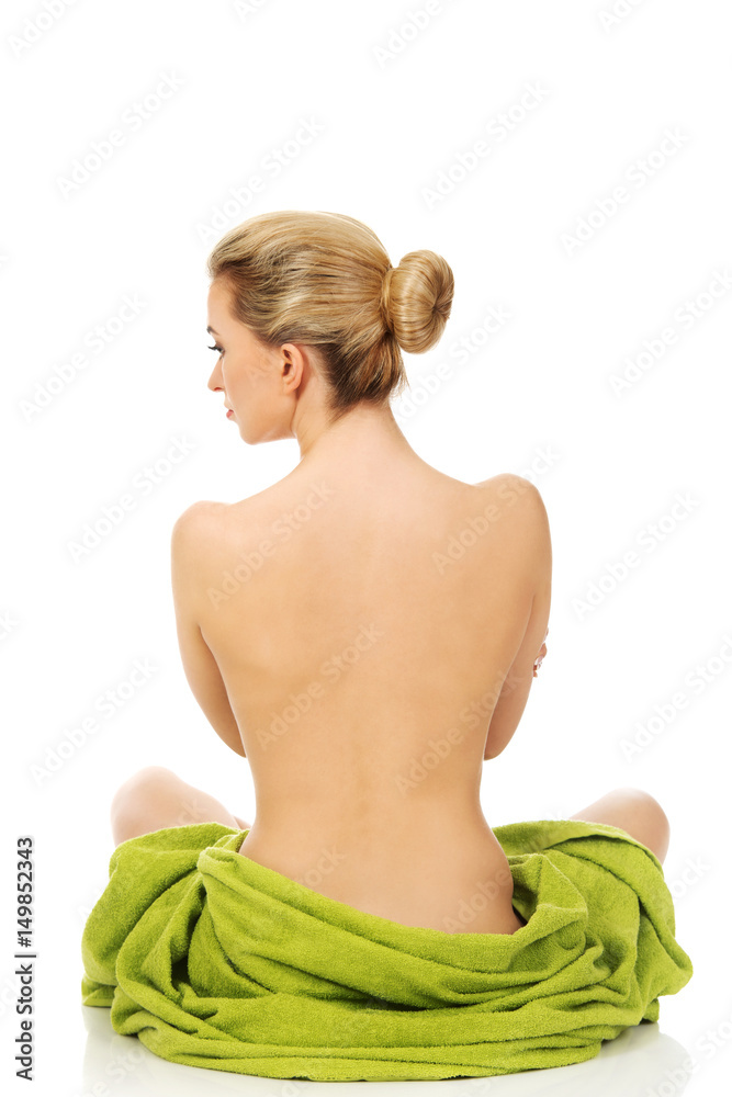 Naklejka premium Young woman sitting in a yoga position