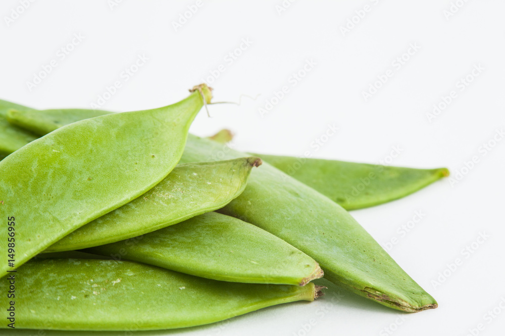 Green peas (Pisum sativum) isolated in white background Green peas (Pisum sativum) isolated in white background
