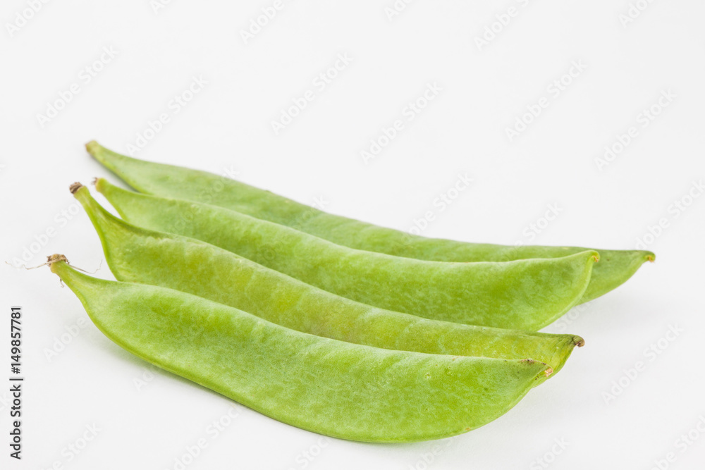 Green peas (Pisum sativum) isolated in white background Green peas (Pisum sativum) isolated in white background