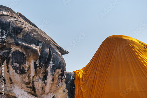 peacful buddha face on blue sky photo