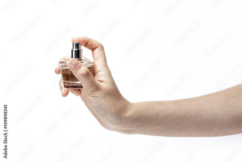 woman hand hold a perfume isolated white. woman hand hold a perfume isolated white.