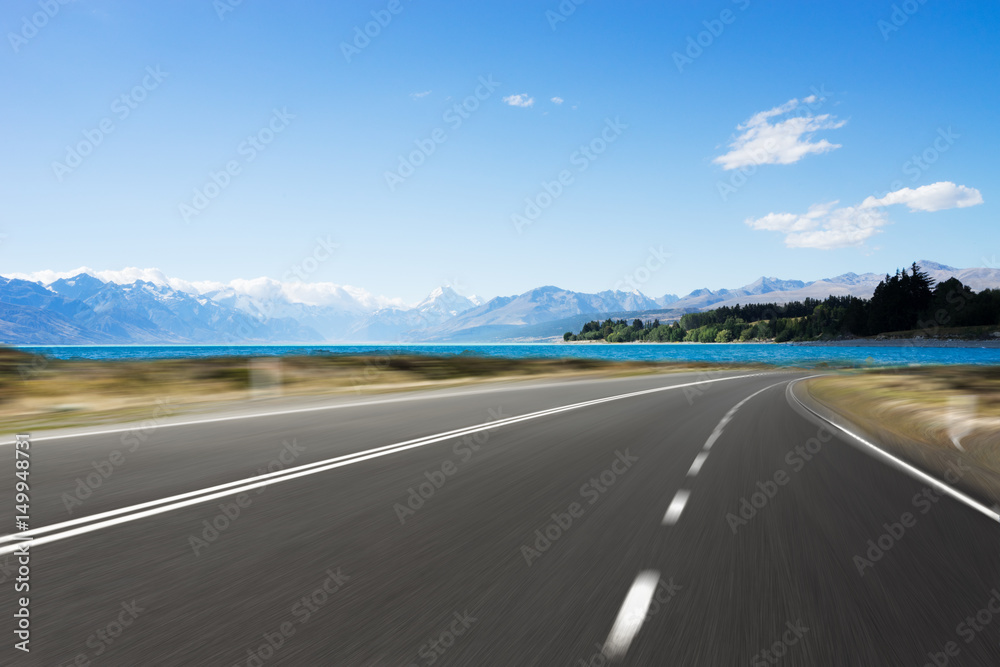 Fototapeta premium empty road with blue sea in blue sky