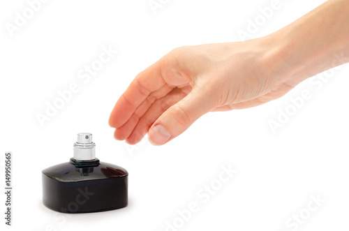 woman hand holding perfume bottle.