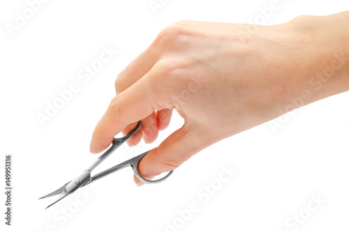 woman hand holding manicure scissors.