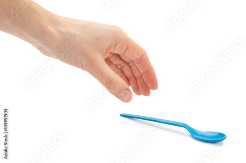 woman hand holding small spoon for kids.