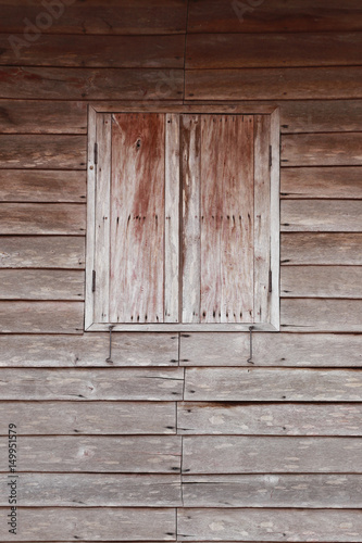 Old wood windows on the wooden wall.
