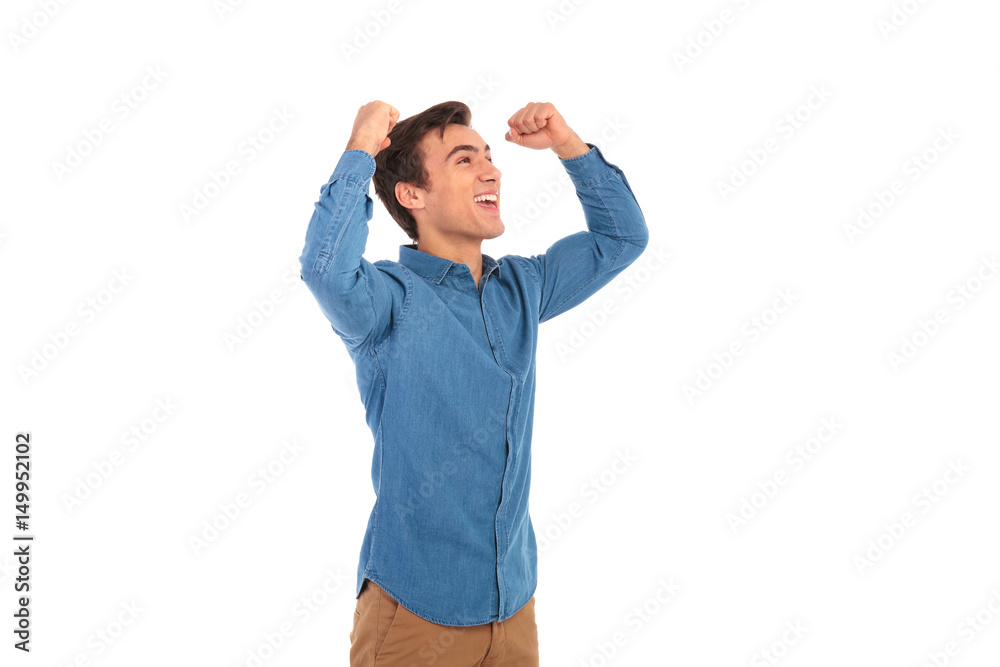 excited casual man celebrating success with hands up excited casual man celebrating success with hands up