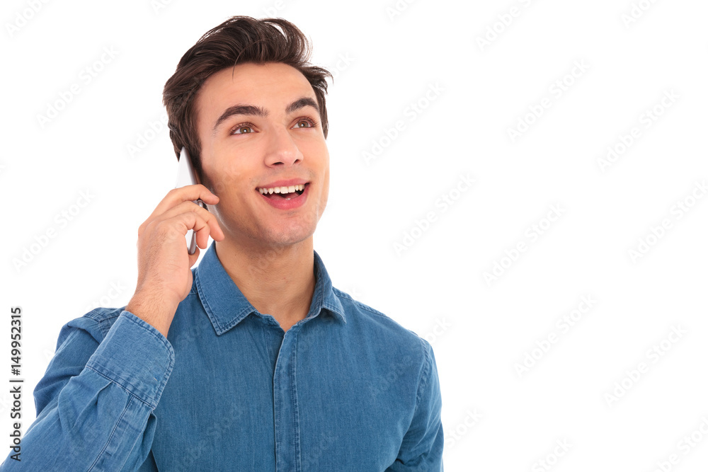 amazed young man talking on the phone amazed young man talking on the phone