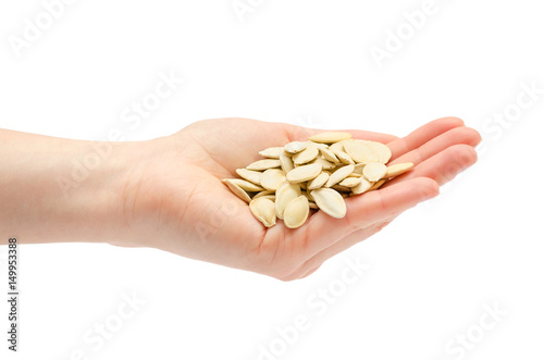 female hand takes or gives pumpkin seeds.