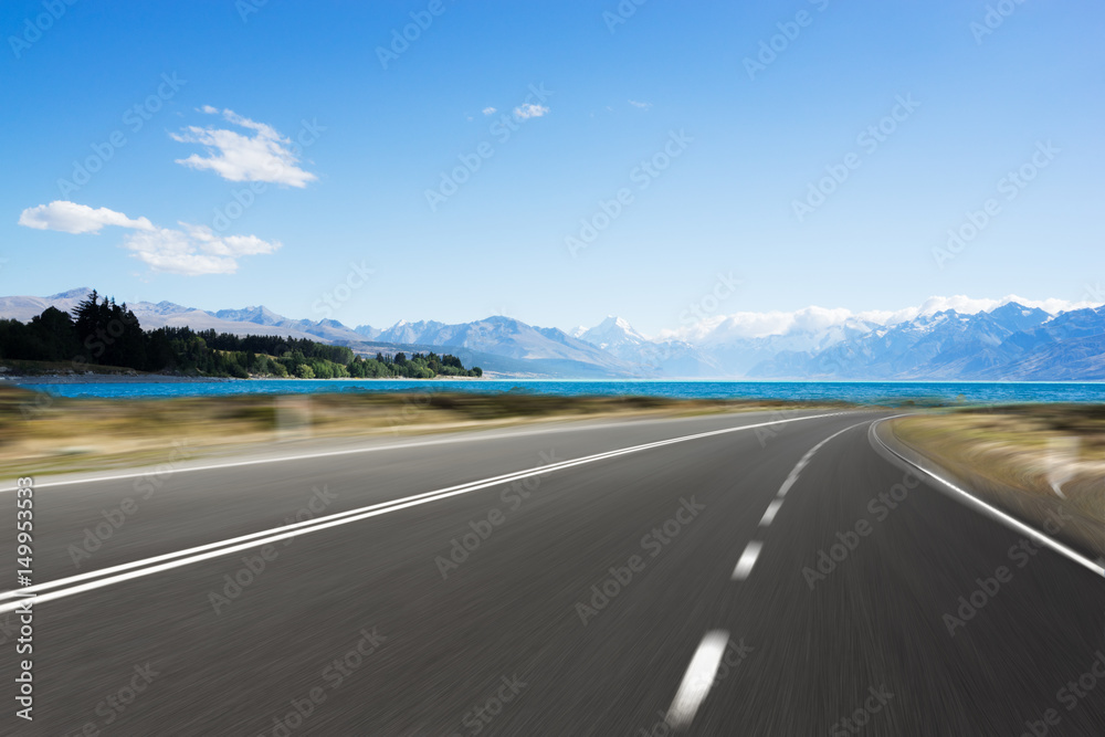 Fototapeta premium empty road with blue sea in blue sky