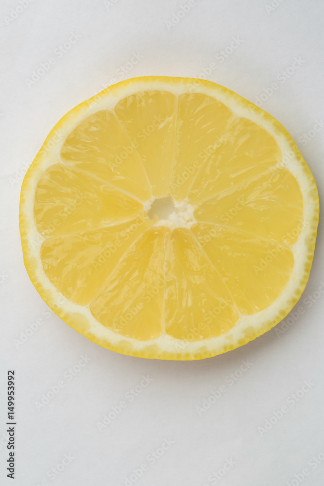 A slice of lemon on white background A slice of lemon on white background