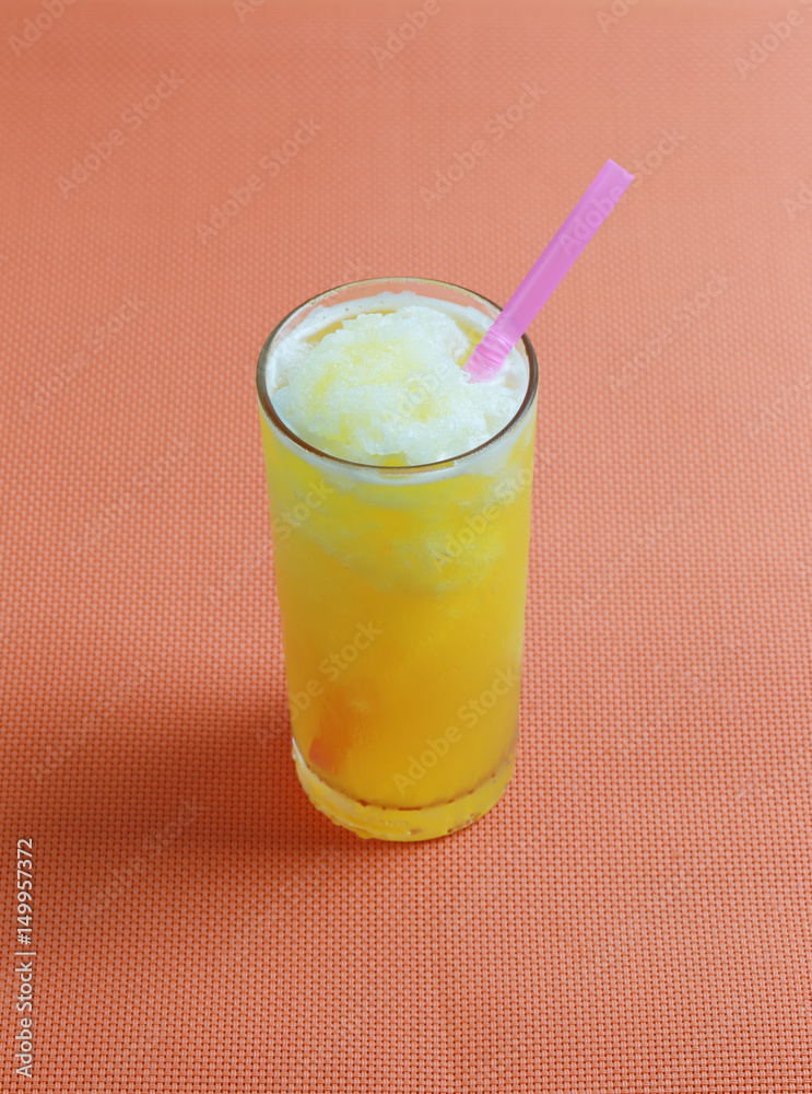Orange juice in glass on table floor. Orange juice in glass on table floor.
