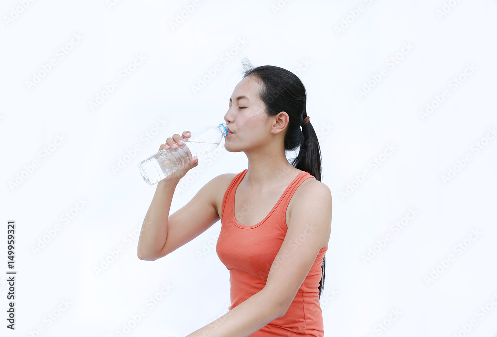 Healthy Woman Drinking Water after Workout, Fitness Girl in Workout Concept on white background. Healthy Woman Drinking Water after Workout, Fitness Girl in Workout Concept on white background.