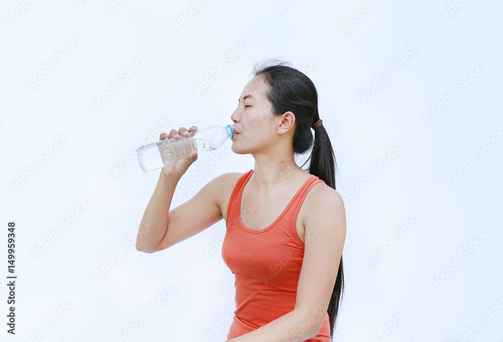 Healthy Woman Drinking Water after Workout, Fitness Girl in Workout Concept on white background. Healthy Woman Drinking Water after Workout, Fitness Girl in Workout Concept on white background.