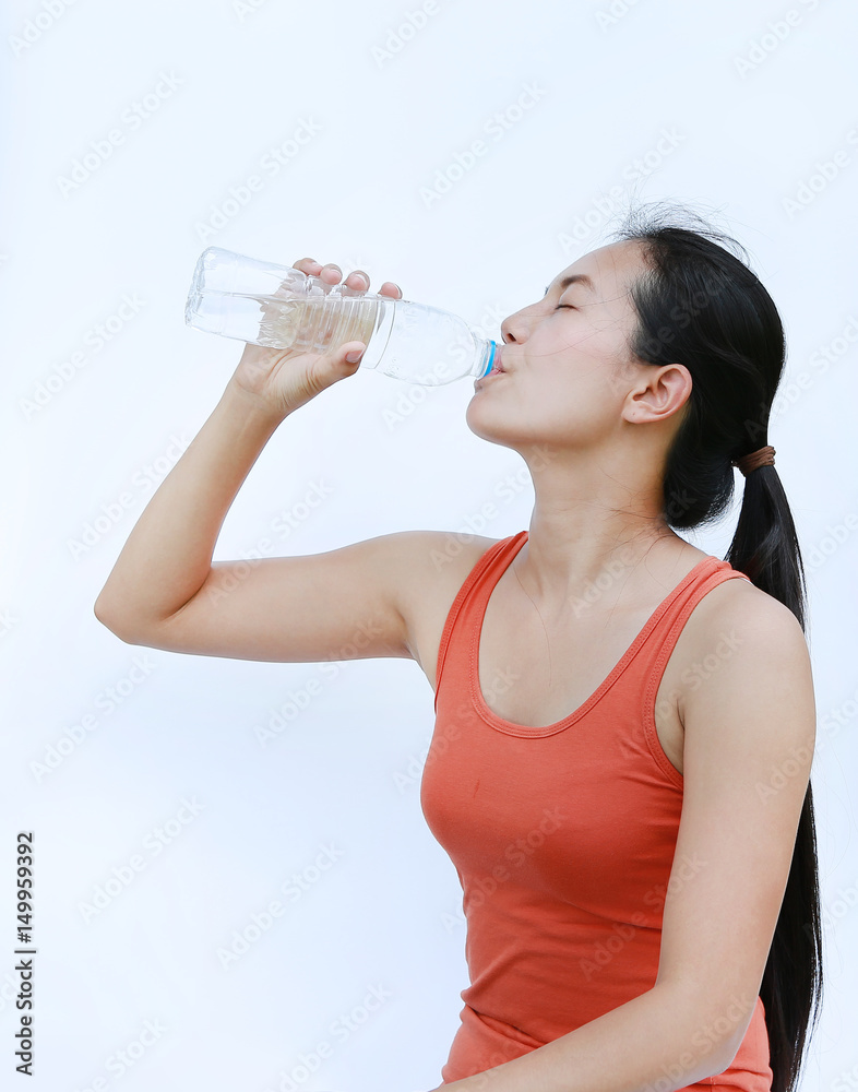 Healthy Woman Drinking Water after Workout, Fitness Girl in Workout Concept on white background. Healthy Woman Drinking Water after Workout, Fitness Girl in Workout Concept on white background.