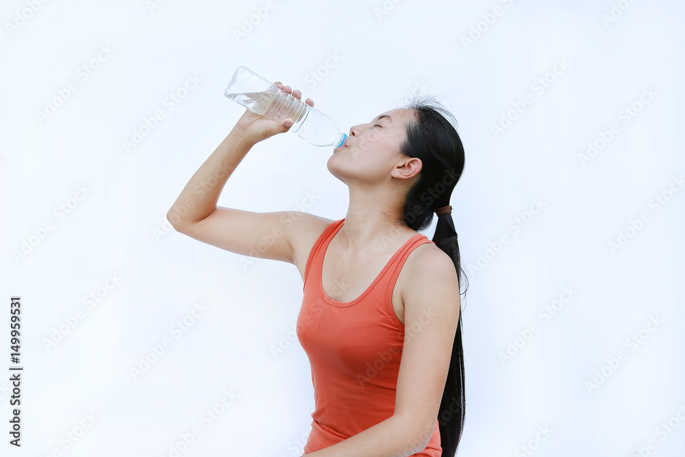 Healthy Woman Drinking Water after Workout, Fitness Girl in Workout Concept on white background. Healthy Woman Drinking Water after Workout, Fitness Girl in Workout Concept on white background.
