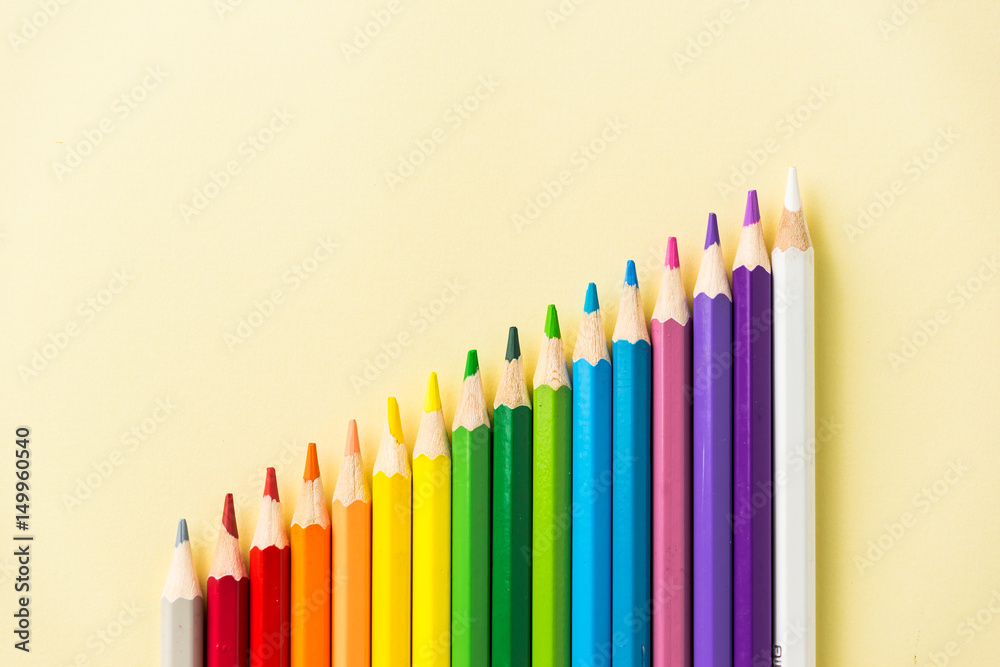 Business concept - Top view of color pencil circle on yellow paper background. Growth, teamwork and united concept. Business concept - Top view of color pencil circle on yellow paper background. Growth, teamwork and united concept.