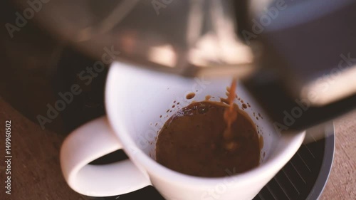 Making hot chocolate in capsule machine - top view - slow motion.