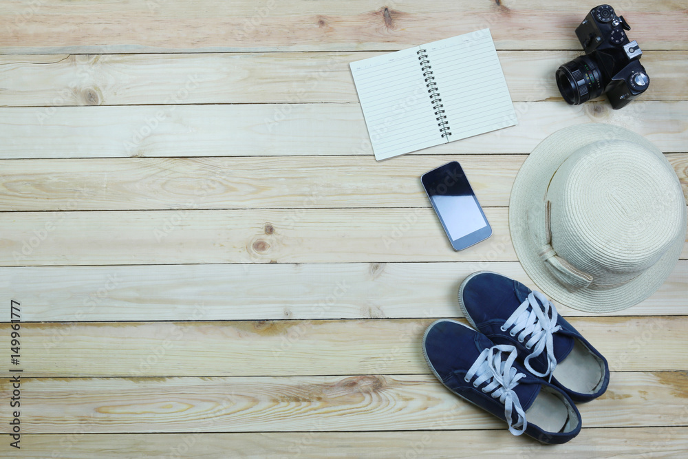 Holiday travel equipment on wooden floor background. Holiday travel equipment on wooden floor background.