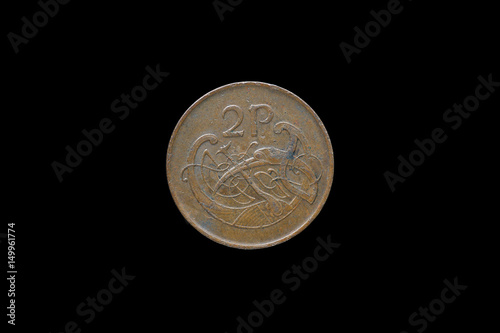 An Irish coin of two pence from 1988 isolated on black background.
