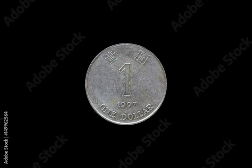 Photography One dollar hongkong 1997 coin isolated on black background.