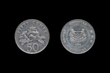 Singaporean 50 cent coin year 1995 isolated on black background.