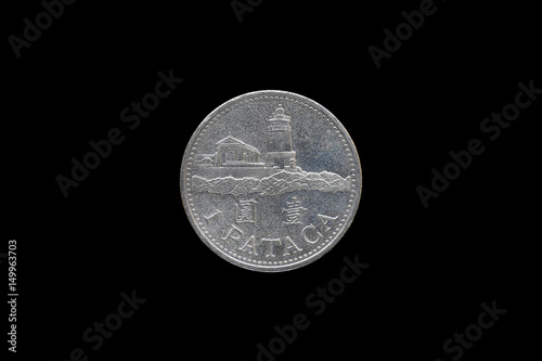 Macao 1 pataca coin isolated on black background.