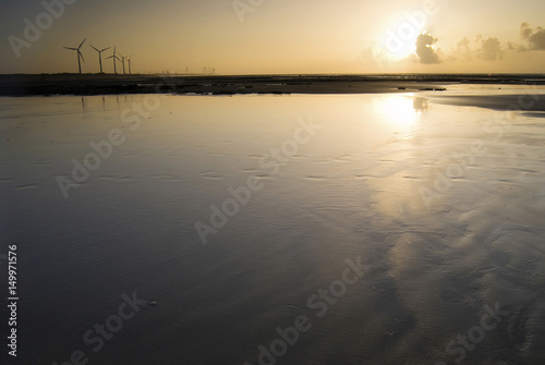 Wind power generator under sunset