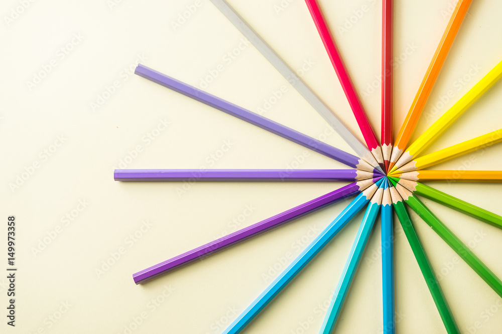 Art concept - Top view of color pencil wave on yellow paper background for mockup design