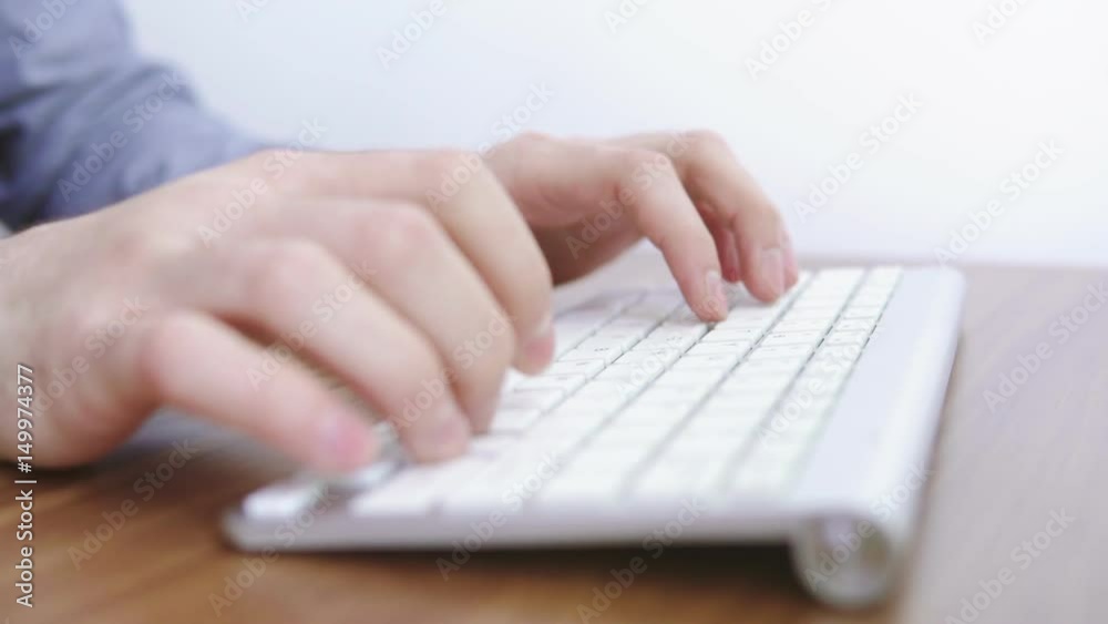 Man's hands typing on the white keyboard. Close view. Business people and technology concept. Shot in 4k Man's hands typing on the white keyboard. Close view. Business people and technology concept. Shot in 4k