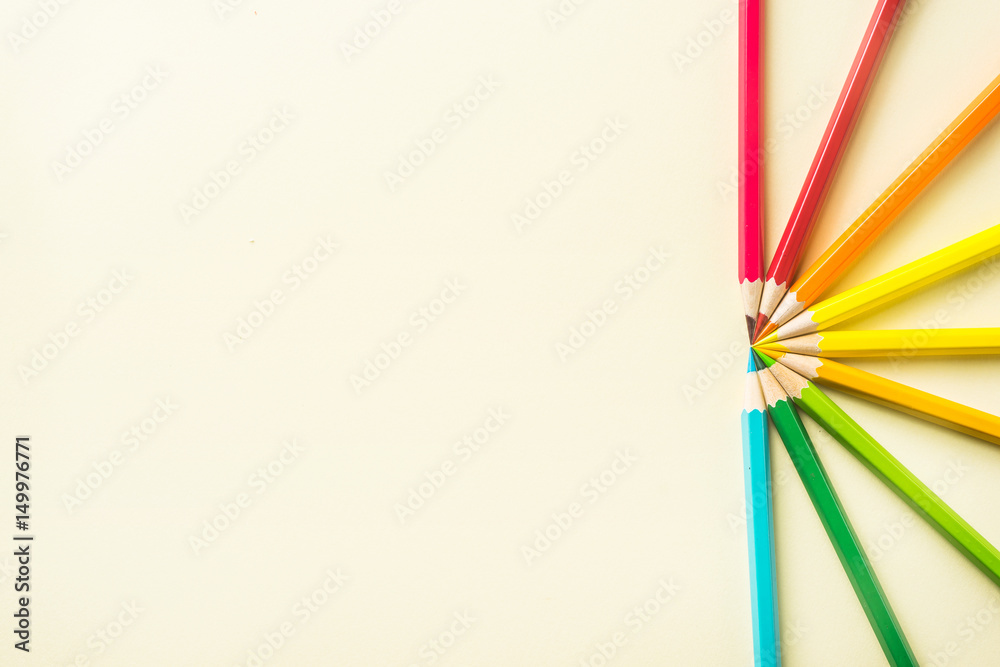 Business concept - Top view of color pencil half circle on yellow paper background, teamwork, united, time and communication concept Business concept - Top view of color pencil half circle on yellow paper background, teamwork, united, time and communication concept